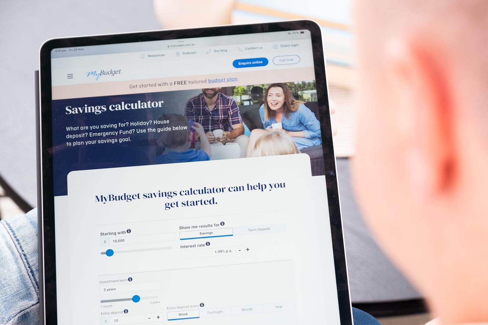 A person using MyBudget’s savings calculator on a tablet to plan savings for goals like a holiday, house deposit, or emergency fund.
