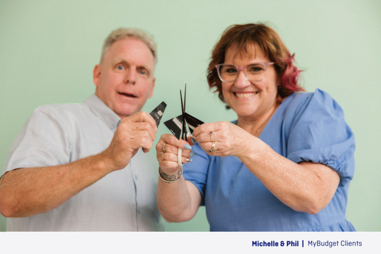 MyBudget clients Michelle and Phil cutting up their credit cards after reducing high-interest debts, late fees and budgeting for real savings.