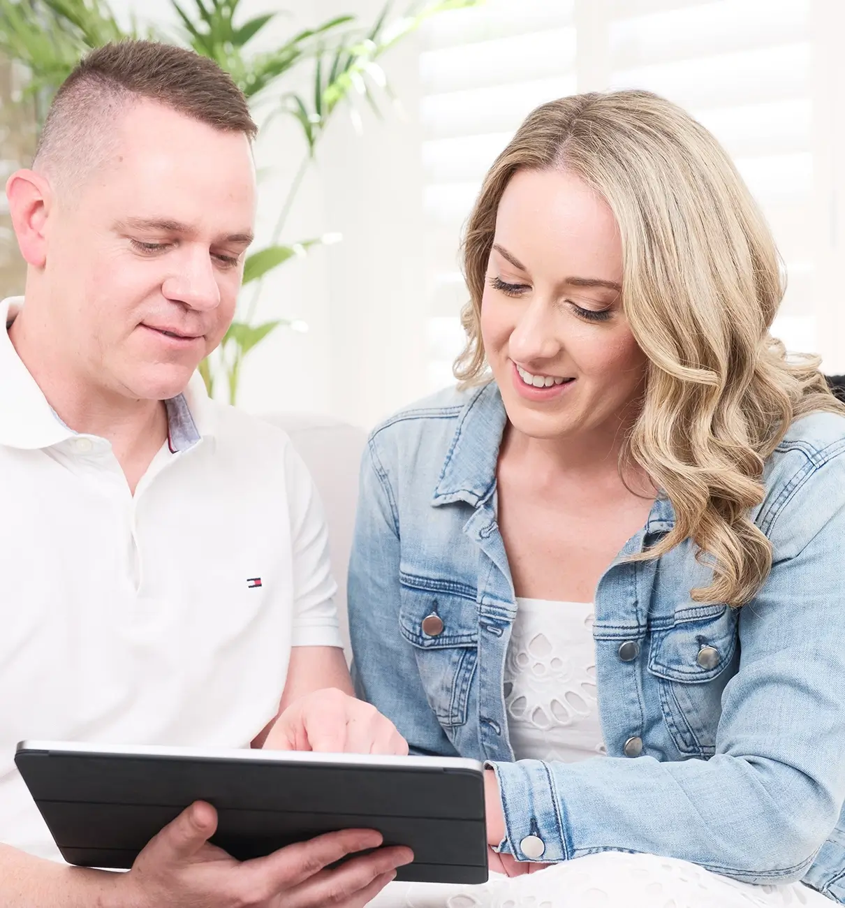 MyBudget clients Adam and Erin reviewing their personal budget and debt solutions using the MyBudget app in Australia.