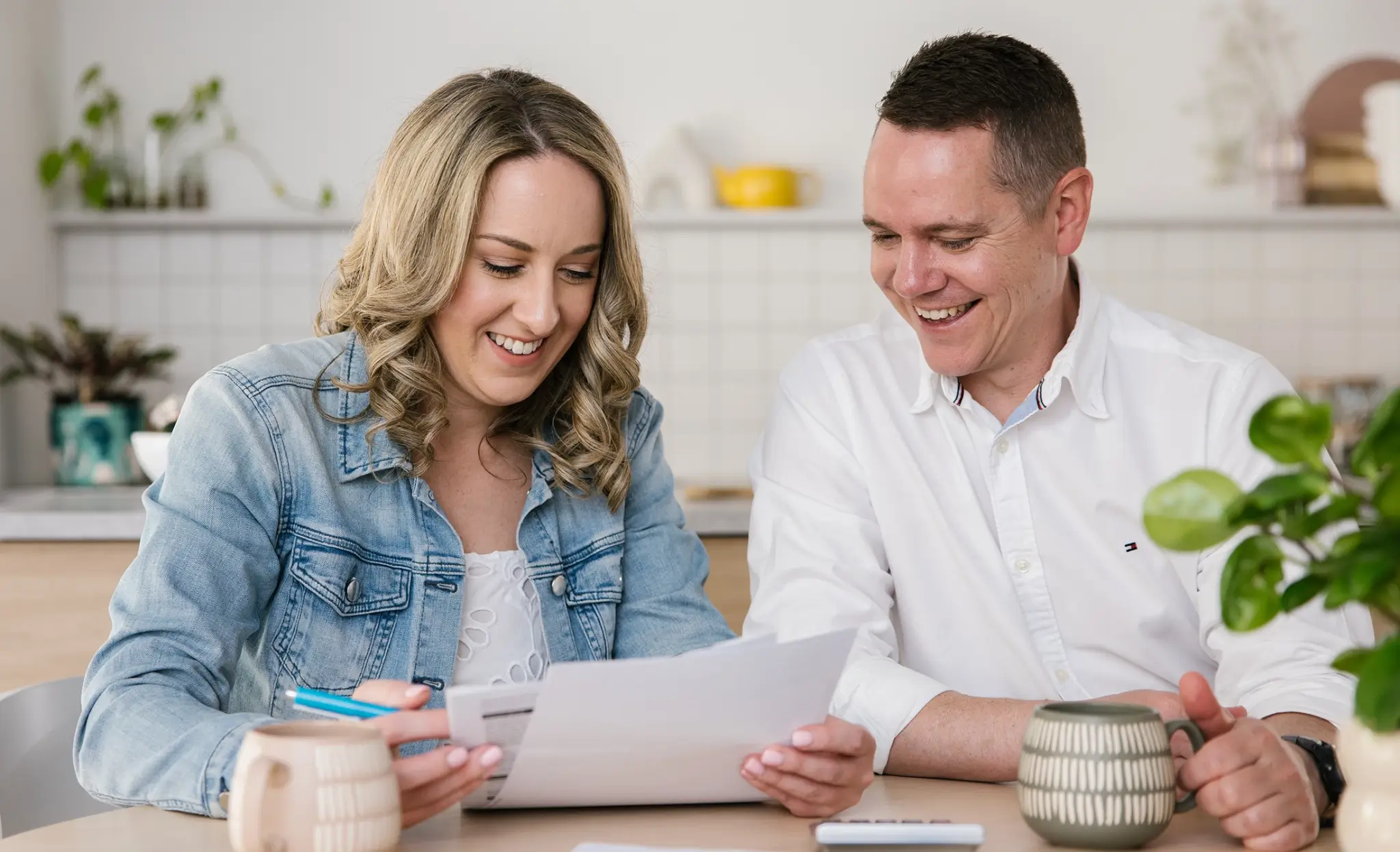 MyBudget clients Erin and Adam celebrating success after using budget planning for bills and achieving financial goals in Australia.