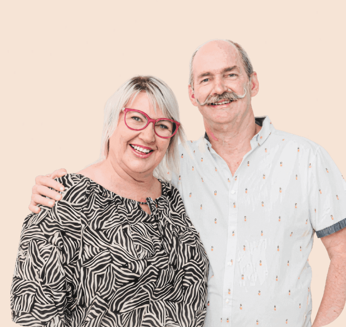 MyBudget clients Kylie and Scott celebrating financial freedom after 18 years of support for budget planning and debt solutions in Australia.