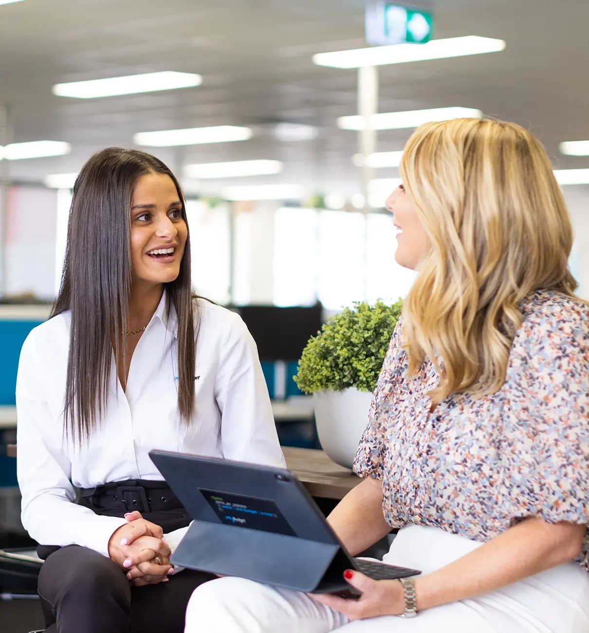 Tammy Barton with a MyBudget team member discussing the supportive, purpose-driven career opportunities available at myBudget Australia.