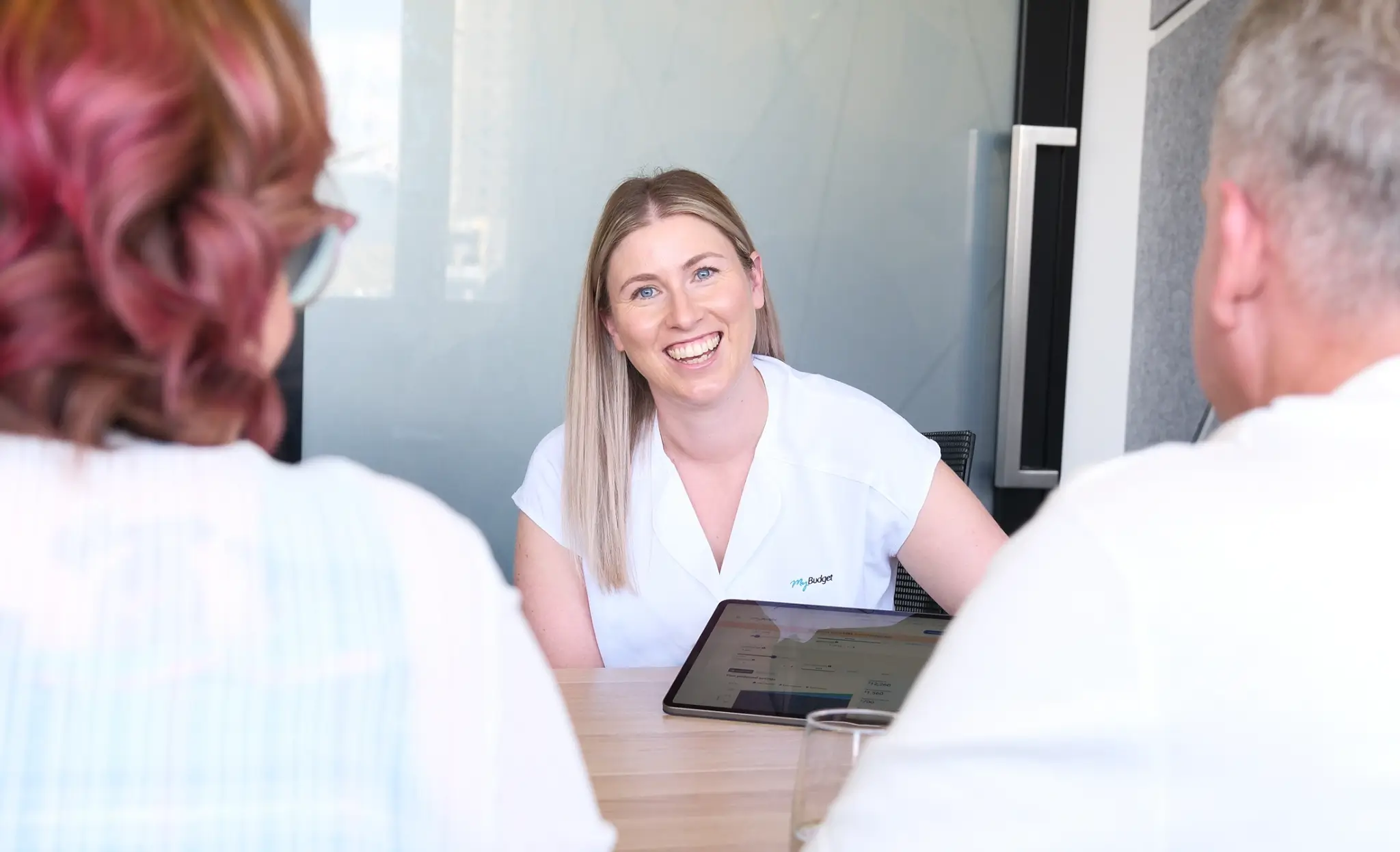 Tara, a dedicated MyBudget team member, providing financial coaching and debt solutions during a client appointment in Australia.