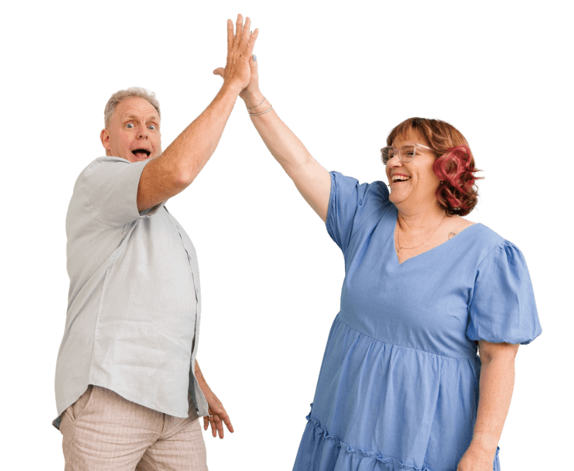 A happy couple, Michelle and Phil, clients of MyBudget Australia, are captured mid-high-five, celebrating their financial success and effective budgeting. The man looks surprised and excited, while the woman is smiling broadly, highlighting the positive results of using MyBudget services to achieve their financial goals in Australia. This image represents the satisfaction and relief of managing personal finances effectively.