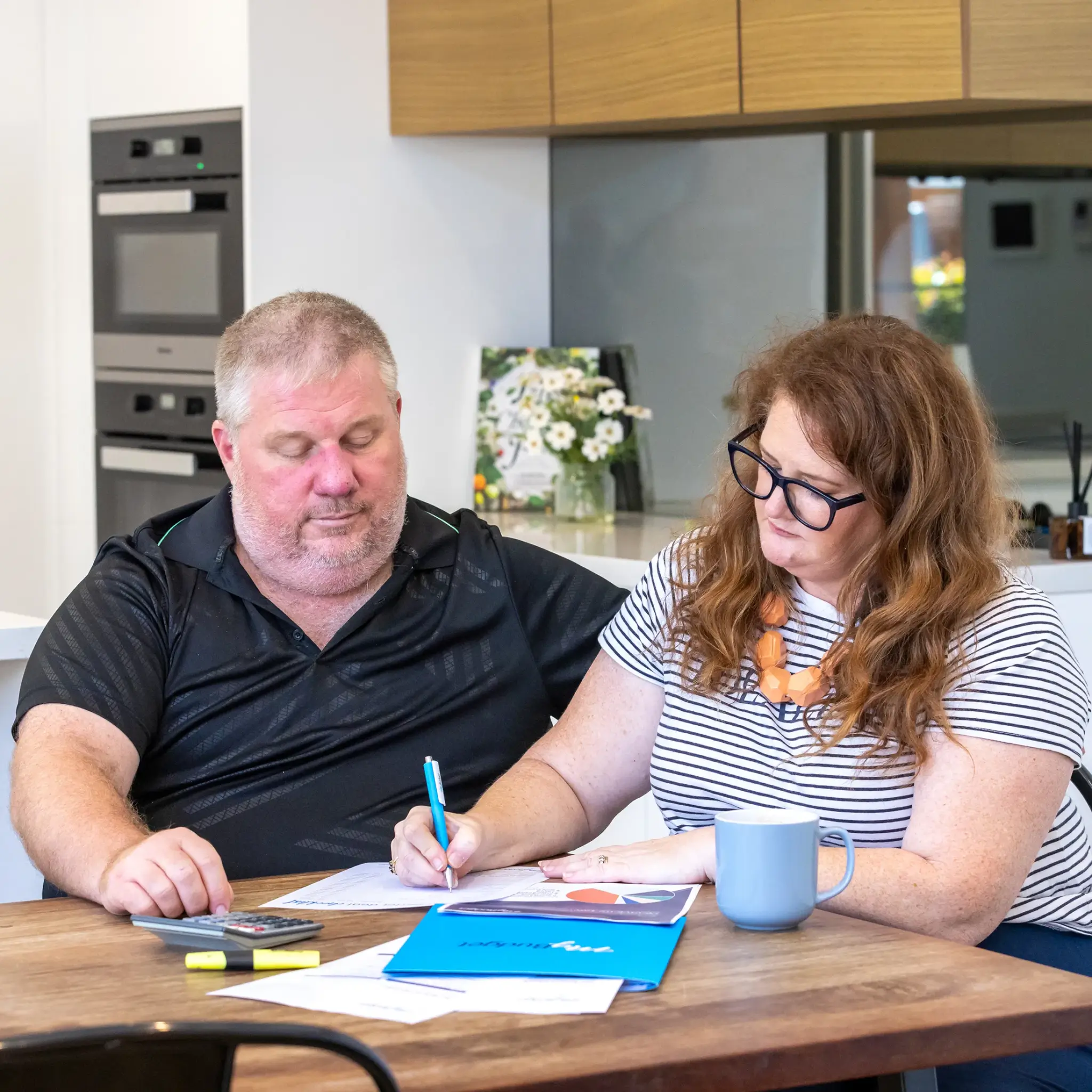 MyBudget clients Alyssa and Pete managing bills with a financial checklist for automated debt management plan and budget planning in Australia.