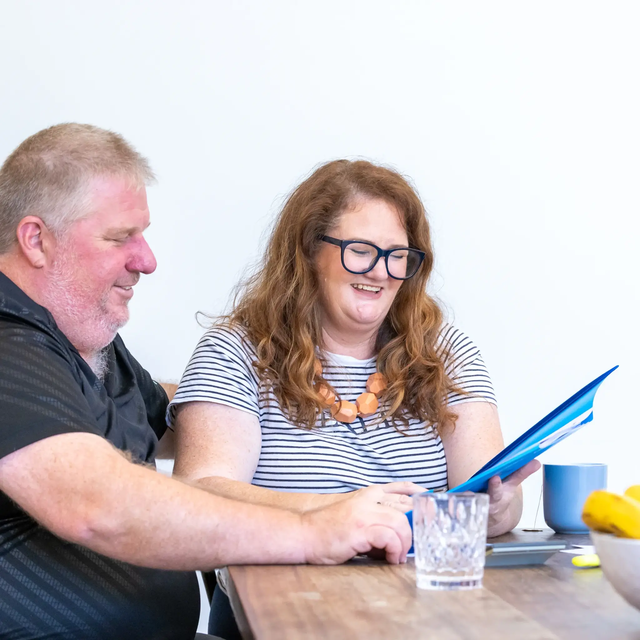 MyBudget clients Alyssa and Pete organizing bills with a dedicated debt management plan and budget planning in Australia.