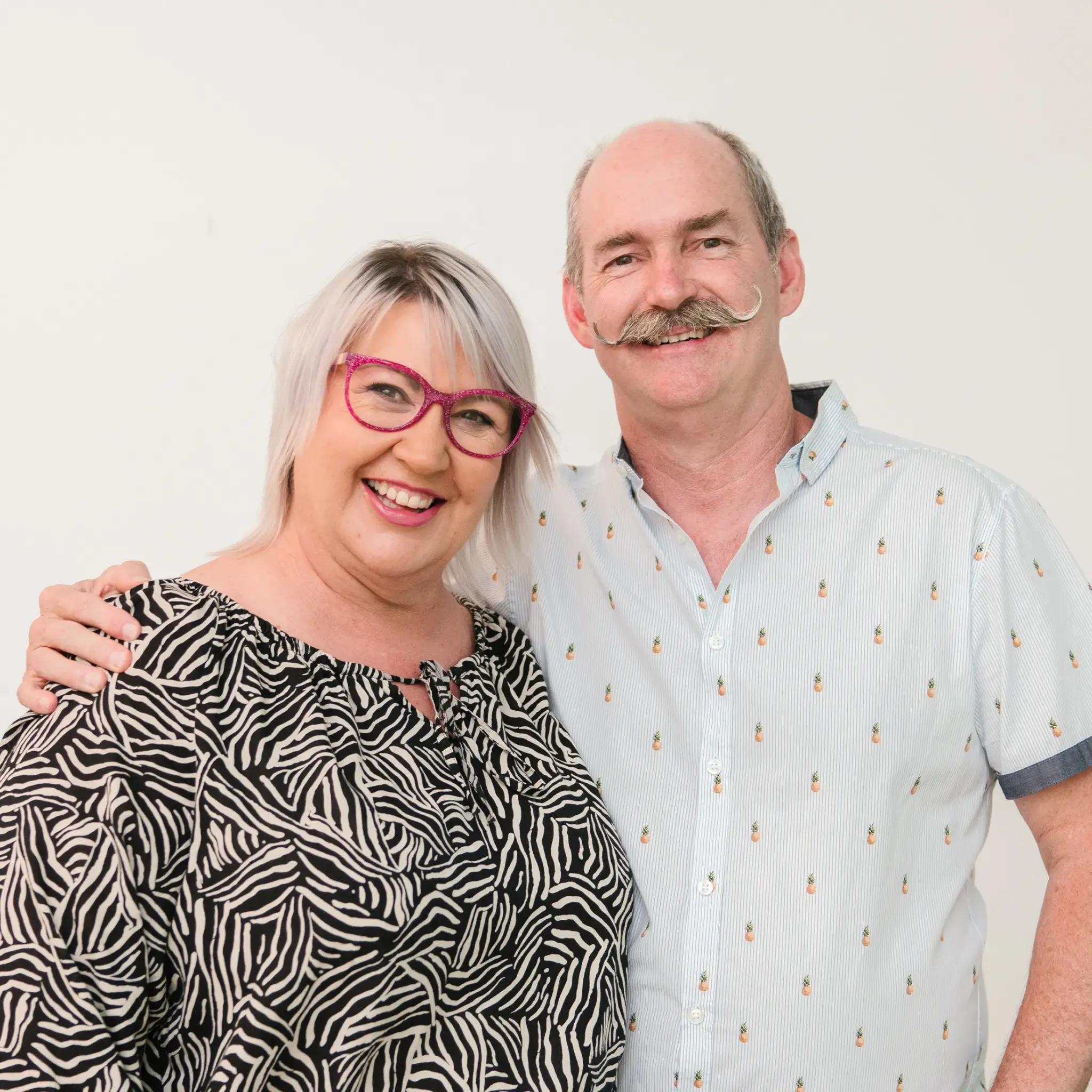 MyBudget clients Kylie and Scott, portrait, celebrating achieving financial goals with successful budget planning in Australia.