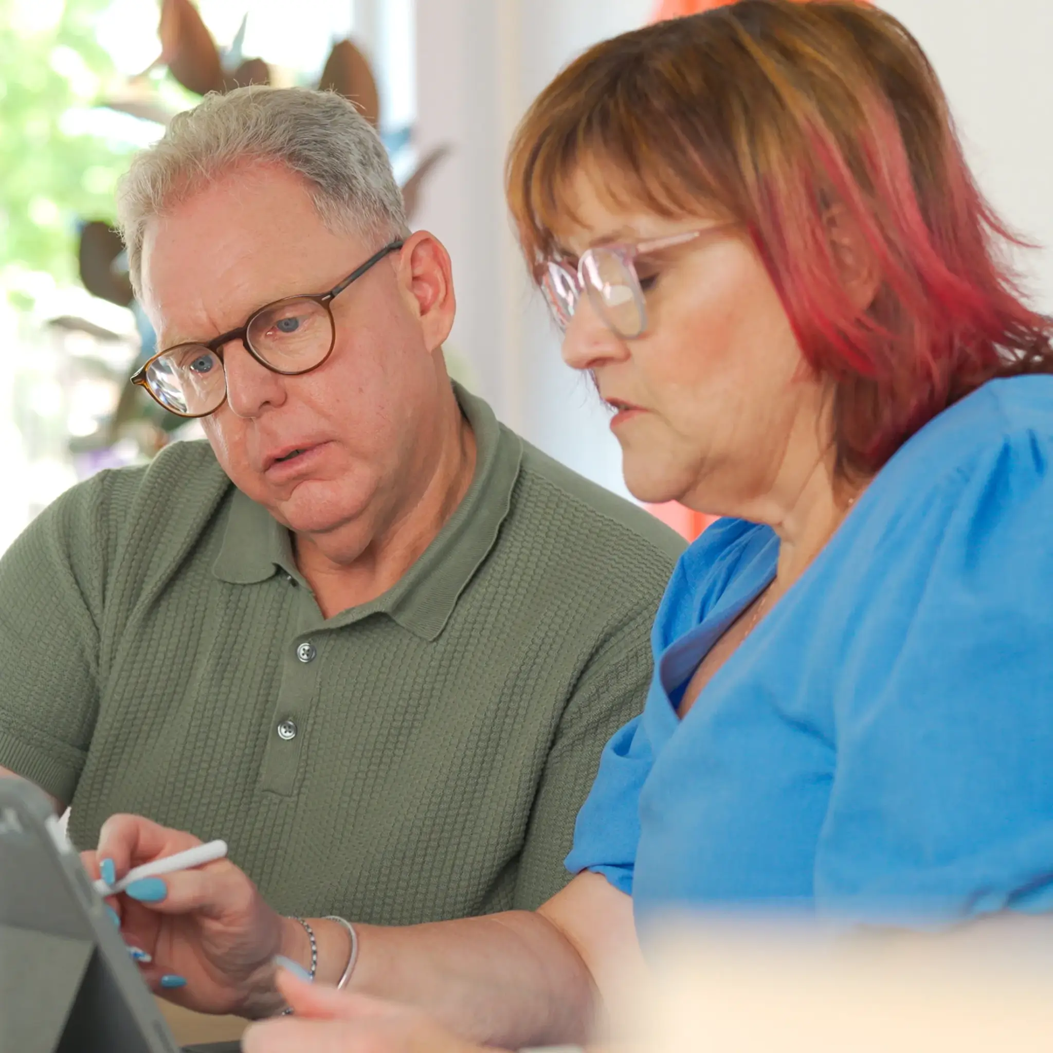MyBudget clients Michelle and Phil organizing bills with a dedicated debt management plan and budget planning in Australia.