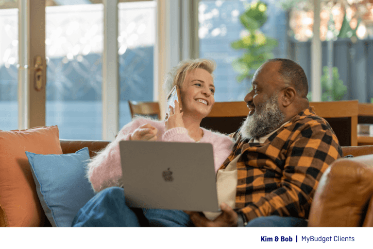 Kim and Bob reviewing their budget together with their MyBudget Money Coach in the comfort of their own home.