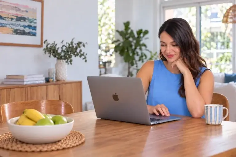 MyBudget client Jaz browsing online sales on her laptop.