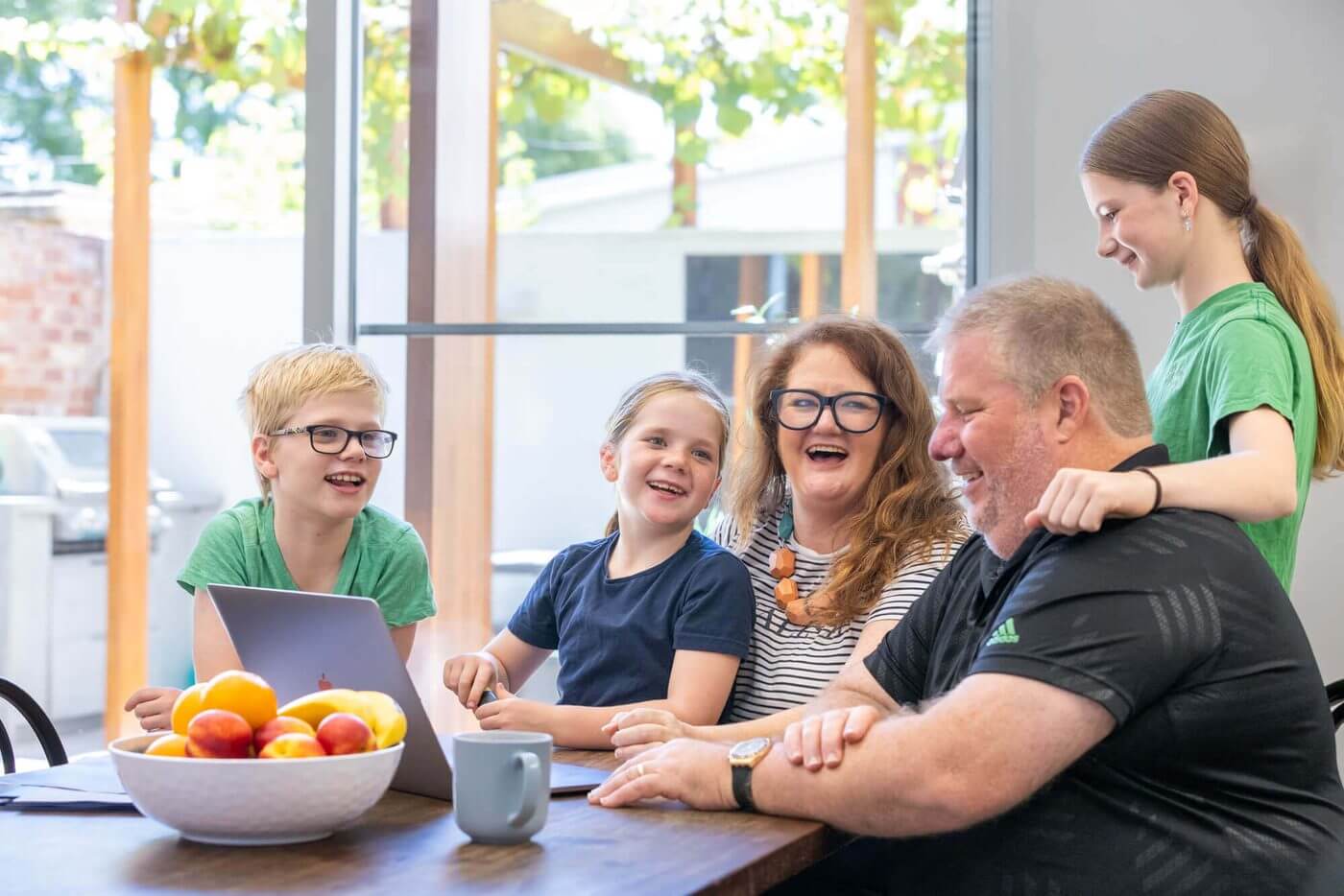 MyBudget clients Alyssa and Pete with their children at home