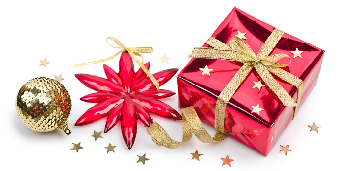 Christmas decorations: a gold bauble, red star and red gift wrapped present with a gold bow wrapped around it
