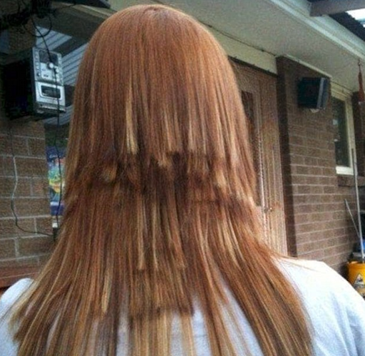 The back of a woman's head revealing her poorly layered haircut