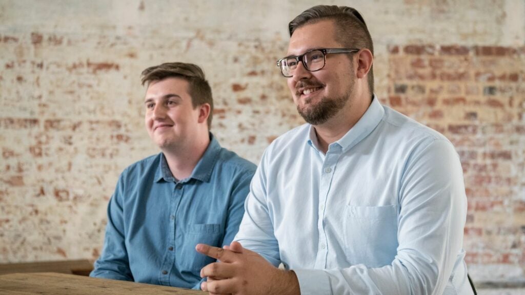 A couple sitting at a desk discussing Non-Confirming Loans