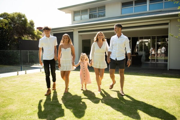 Tammy Barton with her family, sharing her advice on building wealth without relying on inheritance.