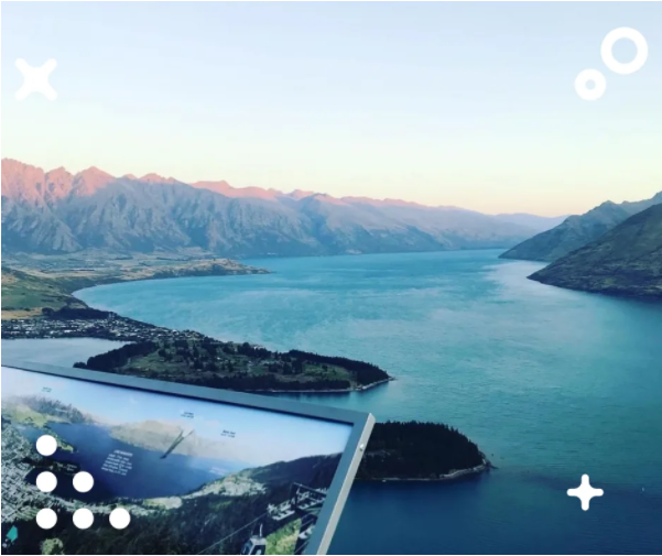 A scenic view of the mountain range and lake in Queenstown, New Zealand.