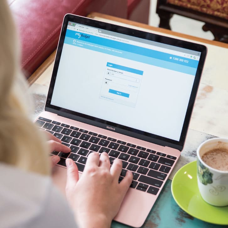 Woman’s hands typing on a keyboard