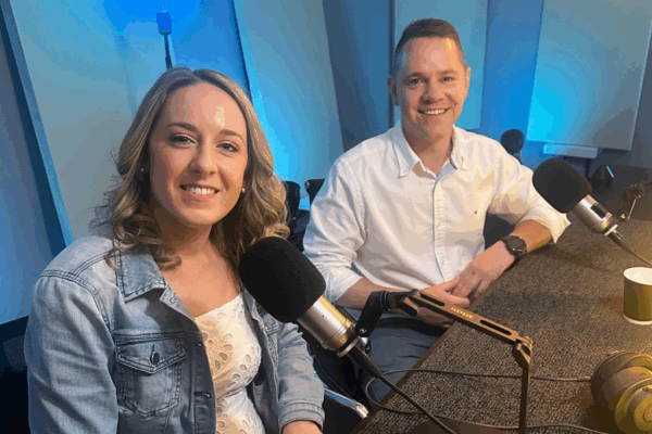 Erin and Adam in the MyBudget, MyMoney MyStory podcast studio, sharing how MyBudget helped them plan a family and achieve financial success.