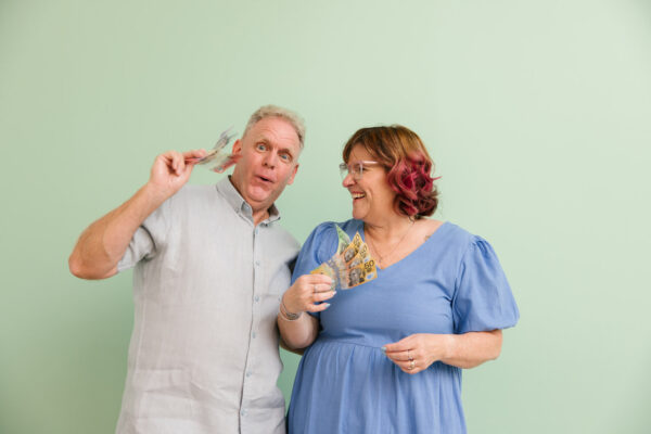 MyBudget clients Michelle and Phil celebrating their savings. With MyBudget’s help, they’ve managed to take control of their finances and save more money.