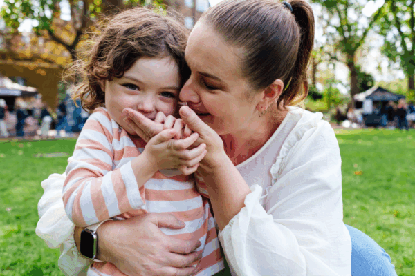 Single mum with daughter in park, showing how MyBudget’s budgeting hacks help single parents thrive in Australia.